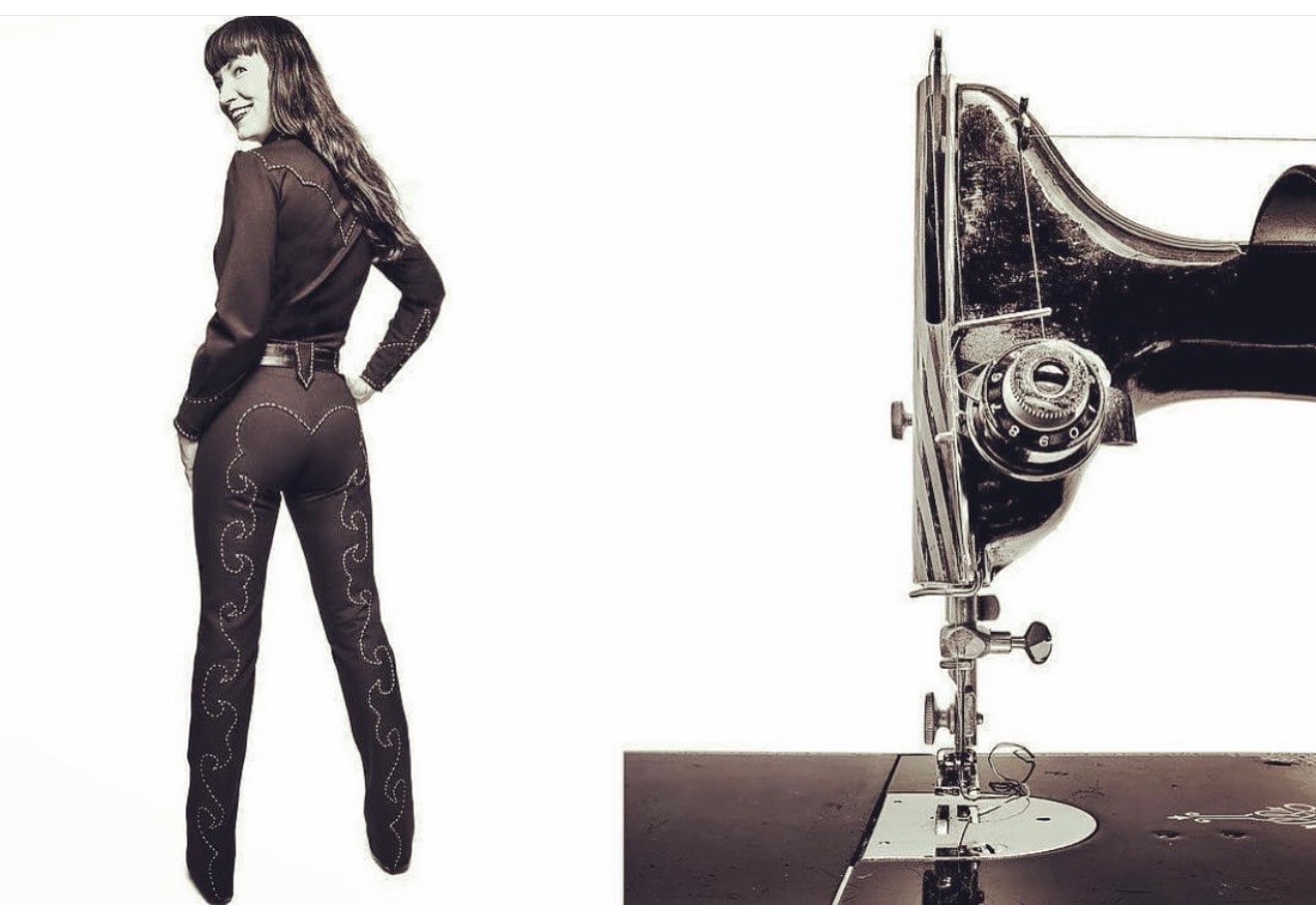 Andrea Heath beside a vintage sewing machine