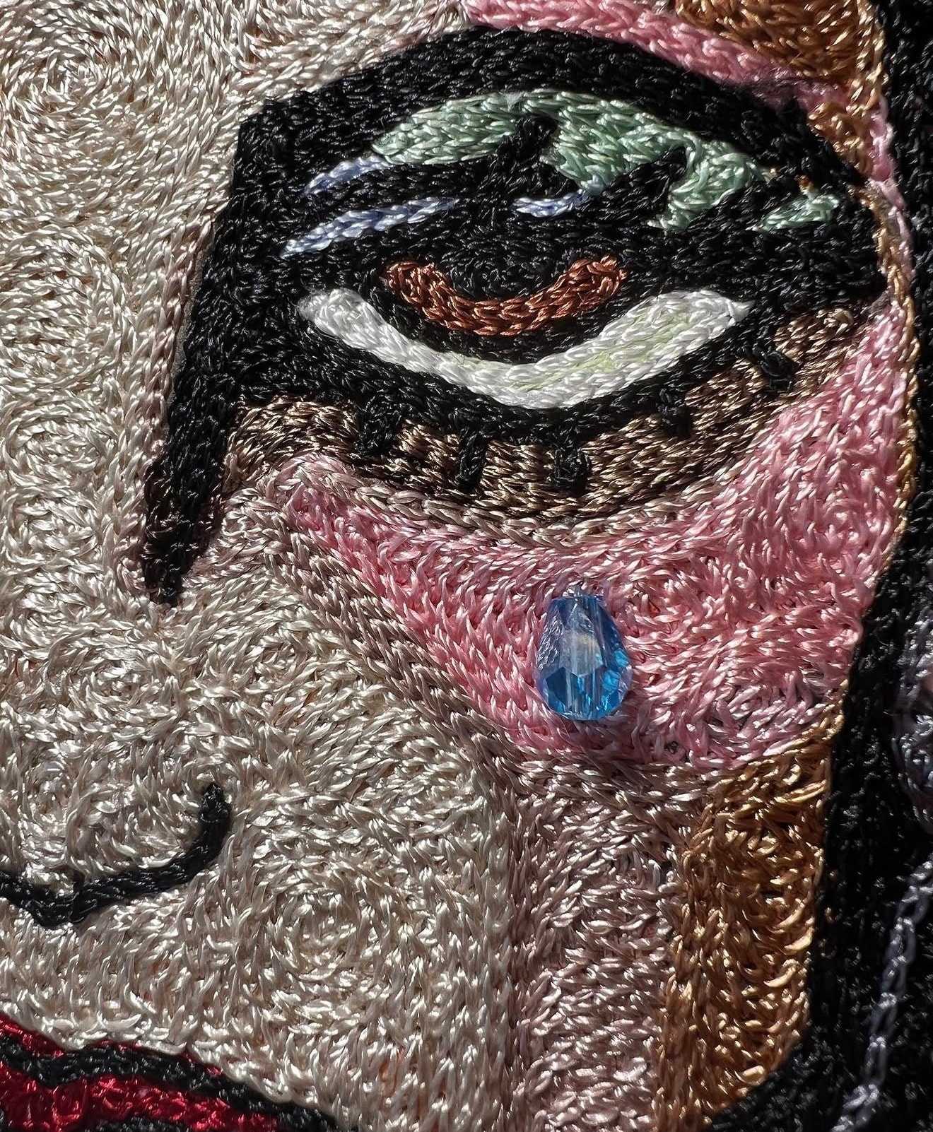 Embroidered patch colorful thread close up